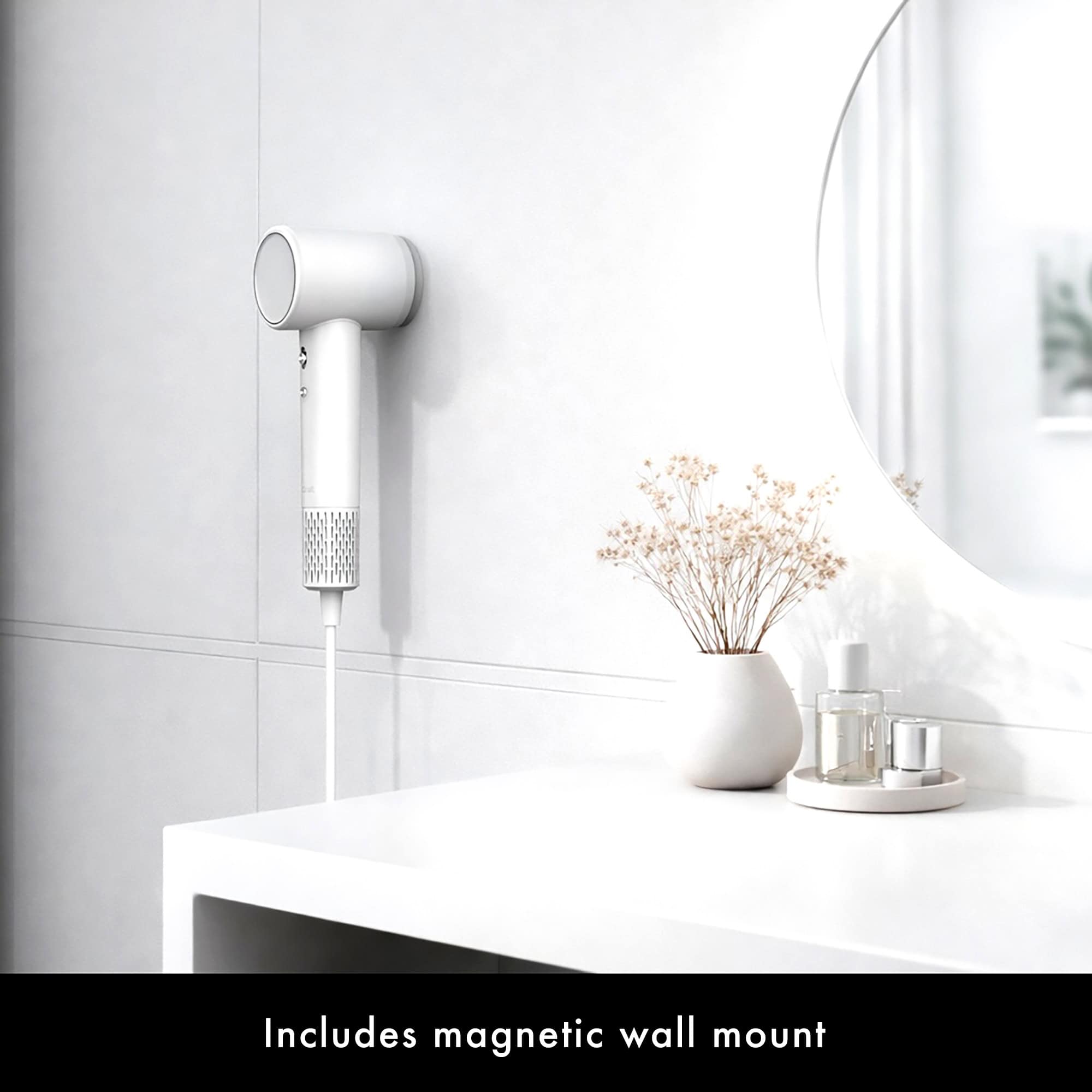 White AirCraft AirMotion hair dryer magnetically mounted on the wall, next to a dressing table