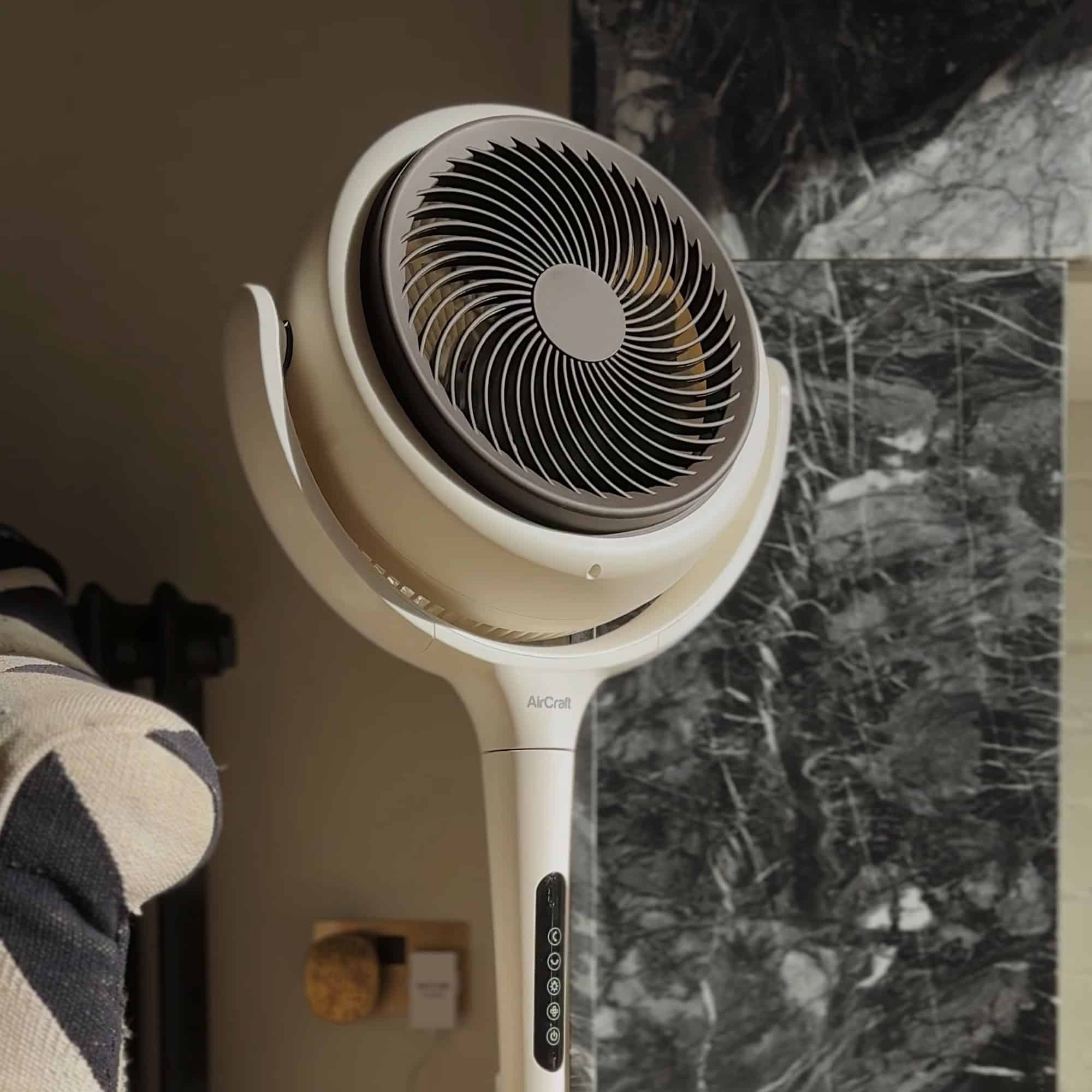 LUME MIDI fan against dark marble fireplace and Diptyque diffuser plug. Photo credit: @housethatblackbuilt